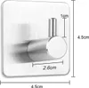 A close-up of a silver adhesive hook with dimensions indicated by measurement lines and text. Produktbild-Vorschau