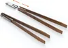 Two pairs of tongs, one assembled and one disassembled with a connecting piece. Produktbild-Vorschau