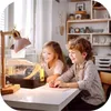 Two children are looking at a small animal cage on a desk. Náhľad obrázku produktu