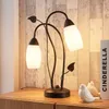 Lindby Tischleuchte Stefania, schwarz/gold, Glas, E14, 40 Produktbild-Vorschau 2
