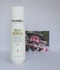 A bottle of Goldwell Dualsenses Rich Repair shampoo is placed next to a photograph of a man. Náhled obrázku produktu