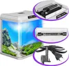 A collage showing a white aquarium with a scenic background, a close-up of the aquarium lid with a heater, a close-up of an LED light bar, and a close-up of a water pump with power cord and plug. Podgląd zdjęcia produktu