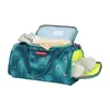 An open teal duffel bag with a bubble pattern, filled with clothes and slippers. Voir les images du produit