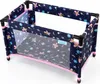 A doll's travel crib with a floral pattern. Produktbild-Vorschau