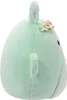 A side view of a light green plush toy with a small flower accessory on its head. Anteprima dell’immagine prodotto