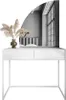 A white vanity table with a mirror reflecting a bedroom interior. Náhled obrázku produktu