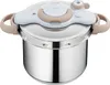 A stainless steel pressure cooker with a white and beige lid, shown from a slightly elevated front-left angle on a white background. Voir les images du produit