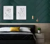 A bedroom scene with a bed, wall art, and a nightstand. Podgląd zdjęcia produktu