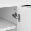 A close-up view of a cabinet hinge on a white cabinet. Anteprima dell’immagine prodotto