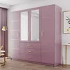 A modern bedroom with a large pink wardrobe and a floor lamp. Produktbild-Vorschau