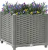 A gray woven planter box filled with colorful flowers. Náhled obrázku produktu