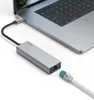 A silver USB-C hub with multiple ports is connected to a laptop. An Ethernet cable is about to be plugged into the hub. Náhľad obrázku produktu
