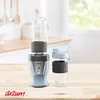 A light blue personal blender and a travel cup sit on a wooden table in front of a kitchen counter. Podgląd zdjęcia produktu