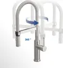 A stainless steel kitchen faucet with a flexible spout and pull-out spray head, shown in multiple positions to demonstrate its 360-degree rotation capability. Anteprima dell’immagine prodotto