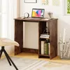 A small wooden desk with a laptop, clock, and books on it, next to a chair in a room. Produktbild-Vorschau