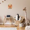 A child's room with a desk, toys, and a wall clock. Produktbild-Vorschau