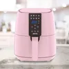 A pink air fryer is shown on a countertop with a blurred kitchen background. Anteprima dell’immagine prodotto