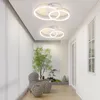 A hallway with two modern LED ceiling lights, decorative striped spheres, and a small tree. Podgląd zdjęcia produktu