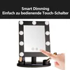 A makeup mirror with lights and a hand touching the screen. Produktbild-Vorschau