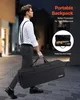 A man walks down a street carrying a large black case, with a smaller image of a saxophone inside a case. Náhľad obrázku produktu