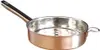 A copper and stainless steel gnocchi sieve with a long handle. Produktbild-Vorschau