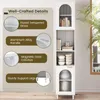 A tall, white cabinet with glass doors and shelves, featuring text highlighting its well-crafted details. Produktbild-Vorschau