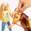 A Barbie doll is interacting with a toy horse and pony. Produktbild-Vorschau