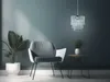 A modern living room corner with a chair, plant, and side table. Produktbild-Vorschau
