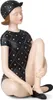 A decorative figurine of a woman in a vintage swimsuit and swim cap, sitting with her legs crossed. Anteprima dell’immagine prodotto