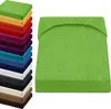 A stack of colorful fitted sheets and a single green fitted sheet. Produktbild-Vorschau