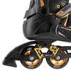 A close-up view of the side of a black and orange inline skate, focusing on the wheels and frame. Produktbild-Vorschau
