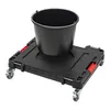 A black transport platform with wheels and a black bucket on top, shown against a white background. Náhľad obrázku produktu