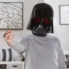 A person wearing a Darth Vader mask and a grey hoodie stands in a room, holding out their hand. Anteprima dell’immagine prodotto
