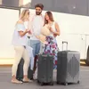 Three people standing with luggage next to a bus. Produktbild-Vorschau
