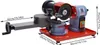 A close-up, angled view of an electric saw blade sharpener on a red base. Náhled obrázku produktu