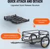 A folded bicycle trailer and an unfolded bicycle trailer are shown against a light gray background, with text highlighting features. Podgląd zdjęcia produktu
