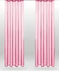 Two pink sheer curtains hanging side-by-side against a light gray and white background. Produktbild-Vorschau