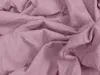 A close-up view of crumpled pink fabric. Náhled obrázku produktu