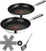 Two frying pans and a spatula are displayed against a white background. Produktbild-Vorschau