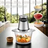 A kitchen scene with a food chopper, ingredients, and bowls of sauces in the background. Produktbild-Vorschau