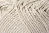 A close-up view of a ball of beige yarn. Náhled obrázku produktu