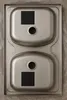 A top-down view of a double stainless steel sink with two black squares placed on each basin. Podgląd zdjęcia produktu