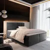 A modern bedroom with a large boxspring bed as the focal point, decorated with ambient lighting and curtains. Produktbild-Vorschau