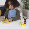 A young child playing with toys on a table. Náhľad obrázku produktu