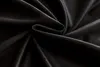 A close-up shot of black velour fabric, showing its texture and folds. Produktbild-Vorschau