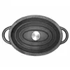 A top-down view of a black oval cast iron pot with a silver knob on the lid. Anteprima dell’immagine prodotto