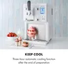 A white ice cream maker with a bowl of strawberries, a glass of milk, and two small ice cream cones on a tray. Náhľad obrázku produktu