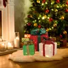 Christmas tree with illuminated gift boxes and candles. Podgląd zdjęcia produktu