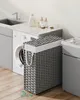 A laundry room scene with a washing machine, sink, and a SONGMICS laundry basket. Produktbild-Vorschau