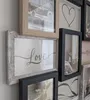 A collage of framed pictures on a wall. Produktbild-Vorschau